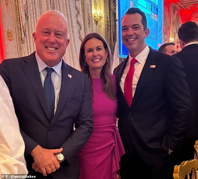 Trump's former press secretary and current Arkansas Governor Sarah Huckabee-Sanders (center) smiled at the party