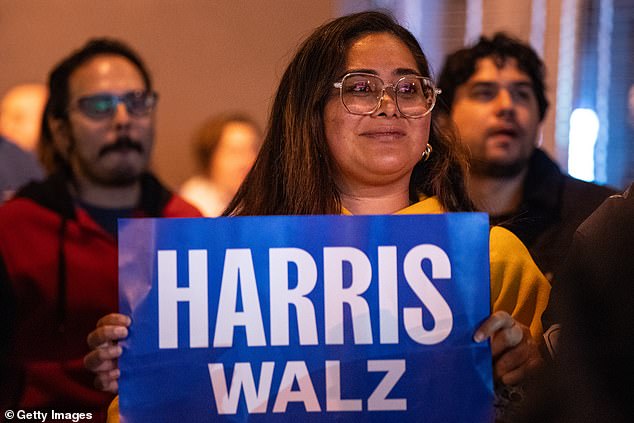 A supporter of Kamala Harris cries as she watches the votes pour in for Donald Trump at an election party in San Francisco