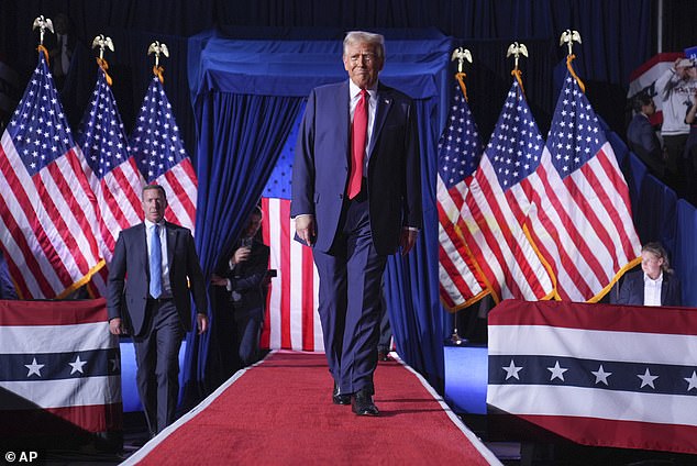 Donald Trump arrives after midnight at the final rally of his campaign in Grand Rapids, Michigan