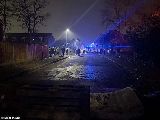 About 20 to 30 people stormed Vine Street in Manchester