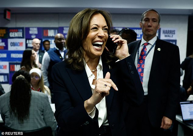 Kamala Harris responds while on the phone at the Democratic National Committee (DNC) headquarters in Washington