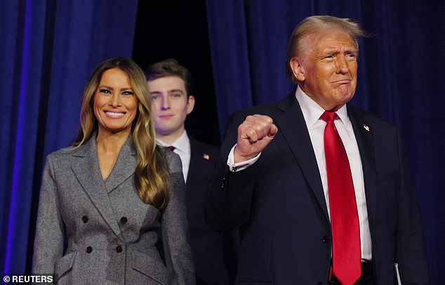 Melania wore a gray suit as she stood next to her husband