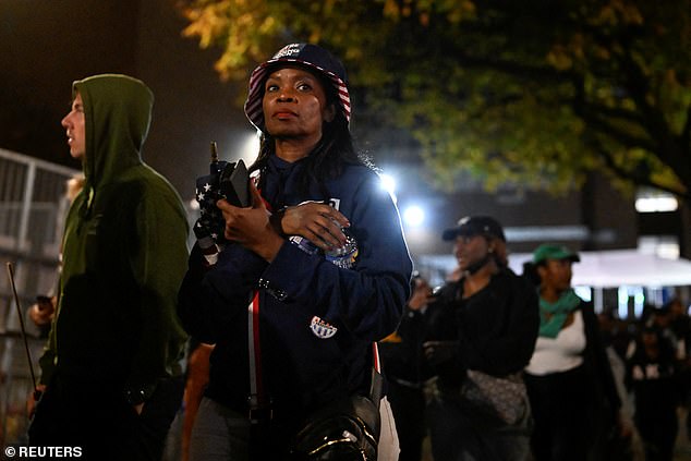 People leave the election rally for US Democratic presidential candidate Kamala Harris