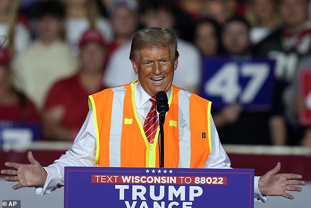 The ex-president wore the neon vest of a garbage truck driver on stage at his rally in Green Bay