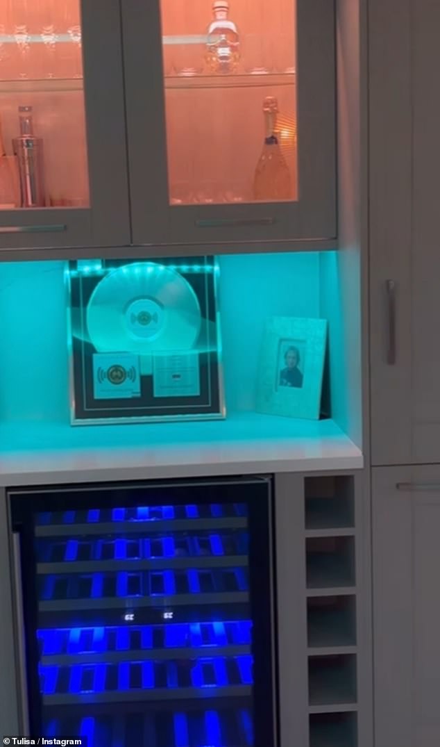 The N-Dubz star referenced her pop career with album covers on the walls and above the wine fridge