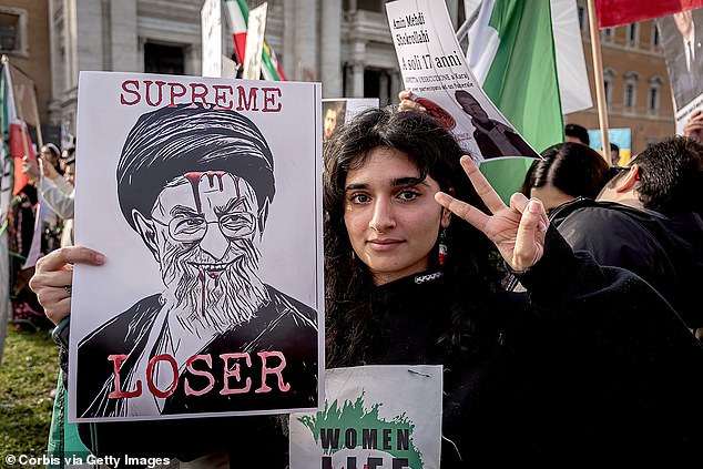 People supporting the Iranian community take part in the Freedom Rally for Iran demonstration against the Iranian regime on February 22, 2023 in Rome, Italy