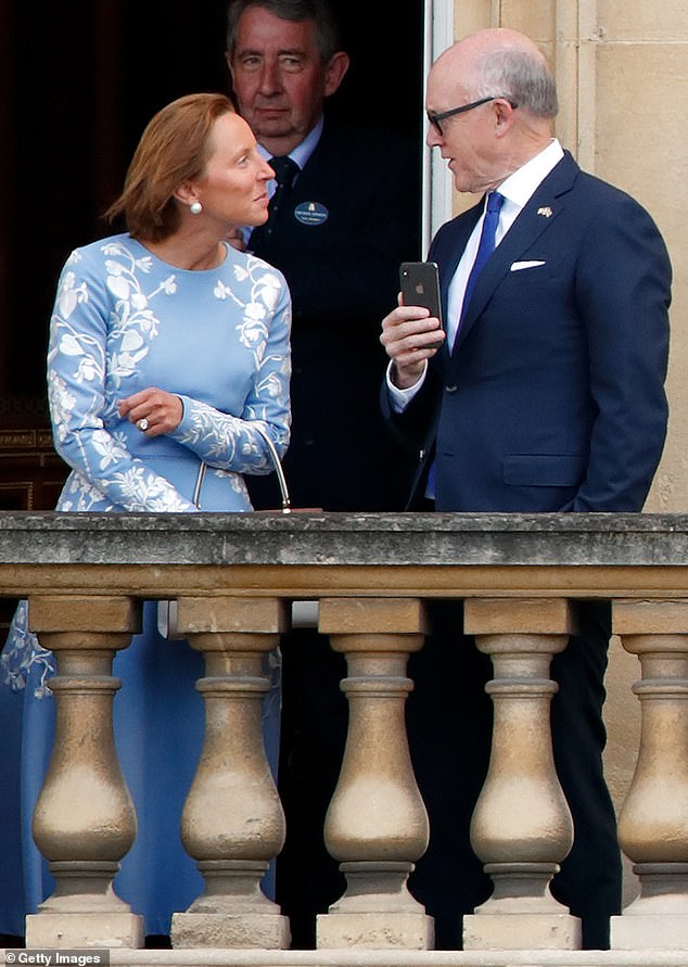 Lindsay Reynolds, Chief of Staff to US First Lady Melania Trump and Woody Johnson, US Ambassador to Great Britain stand on a balcony of Buckingham Palace in 2019