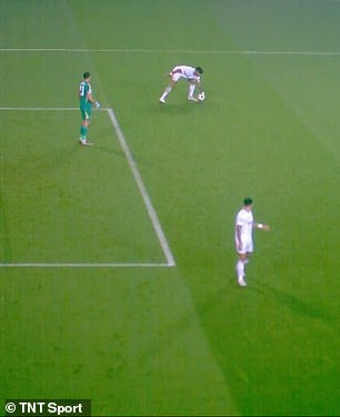 Mings picks up the ball after Martinez's goal kick