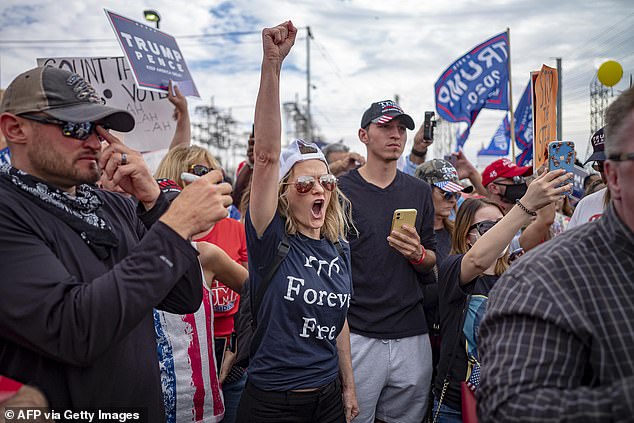 This county has long been seen as a tinderbox in a country smoldering with political resentment and division. (Trump supporters protest in front of the Maricopa County Elections Department in 2020).