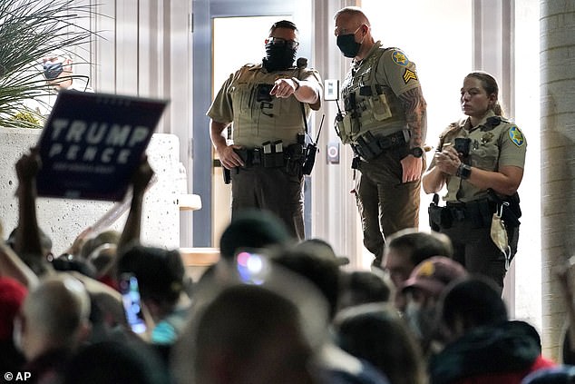 Maricopa County Recorder Stephen Richer had particular reason for concern. It was his office – located in the provincial Supreme Court building – that was targeted. (Deputies line up at the door of the Maricopa County Recorder's Office in 2020).