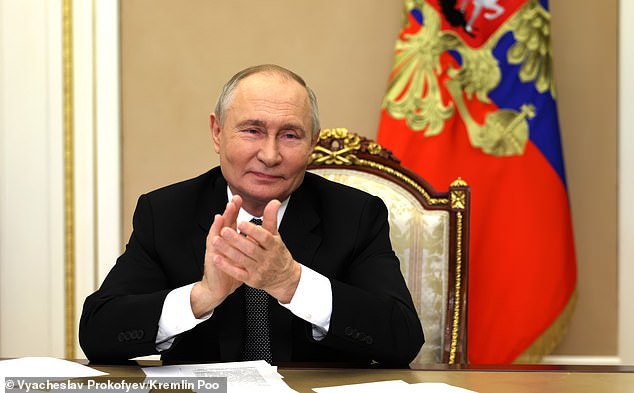 Russia boasted that Trump's election would likely be bad news for Ukraine. Pictured: Vladimir Putin applauds during a remote ceremony to launch the Arktika-class nuclear-powered icebreaker Chukotka from the Kremlin on Wednesday