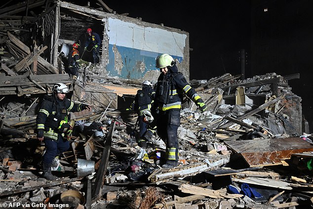 Rescue teams inspect the remains of a building after a strike in Kharkiv, November 1, 2024