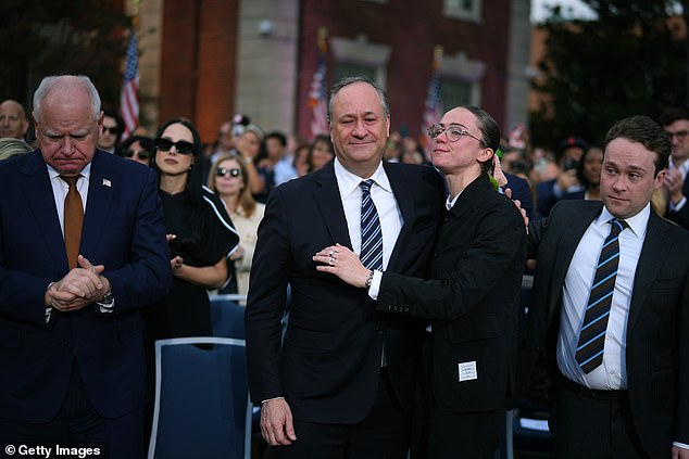 The 60-year-old was hugged by his daughter Ella as a somber-looking Governor Walz bowed his head