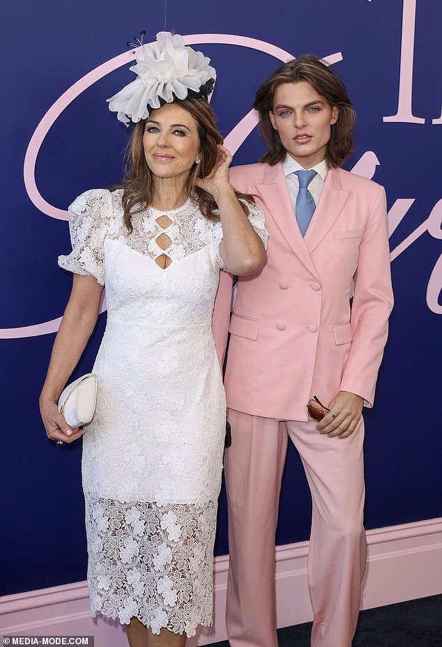 Damian looked dapper in a pastel pink two-piece suit,