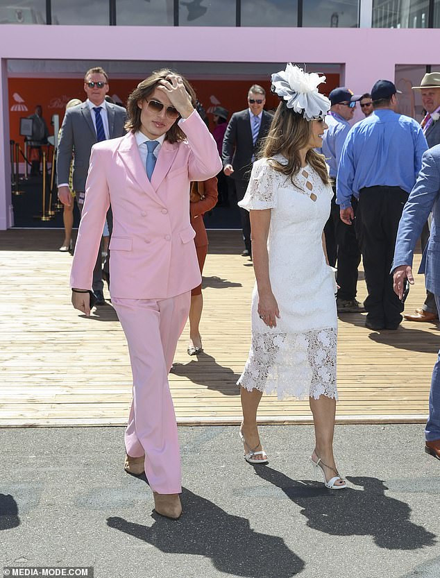 After Liz made a bold statement in yellow earlier this week, the mother-son duo perfectly summed up the pastel and white themed dress code