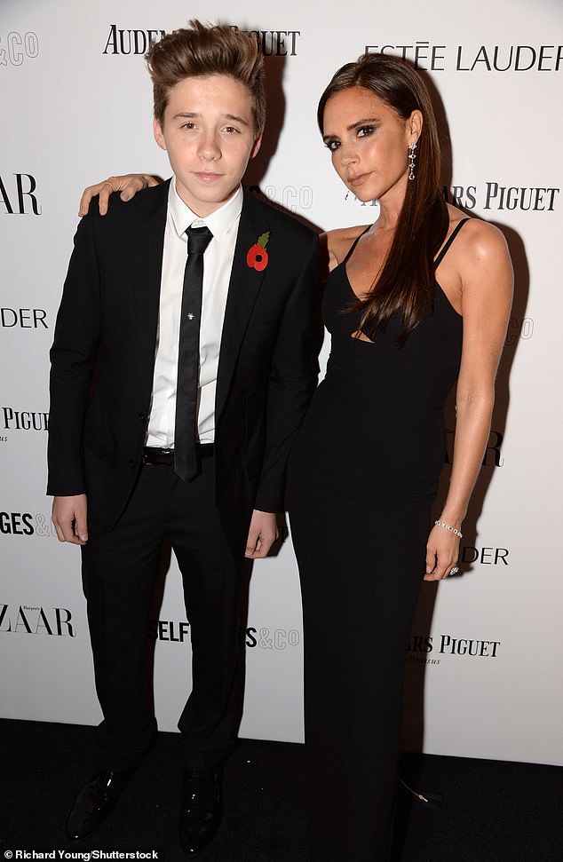 Harper's appearance mirrors that of her eldest brother Brooklyn in 2013. He is pictured with Victoria at the Harper's Bazaar event in November that year.