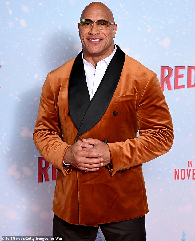 Meanwhile, Dwayne was every inch the Hollywood heartthrob in a rust-colored jacket that appeared to be made of velvet or velvet