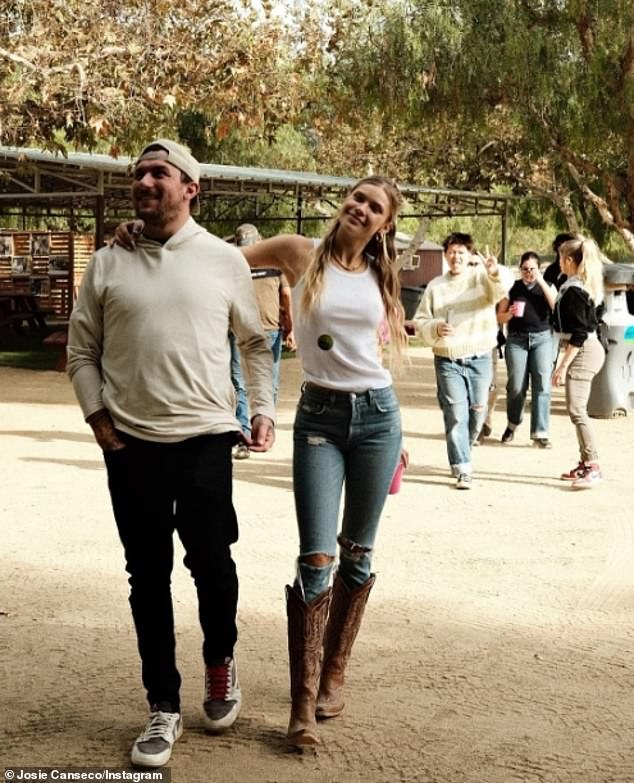 Josie stayed comfortable in a white tank top, blue jeans and cowboy boots during the outing