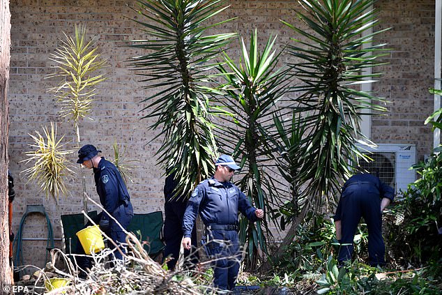 Police search the Kendall home in 2021 around the time the foster mother and father were questioned by the NSW Crime Commission