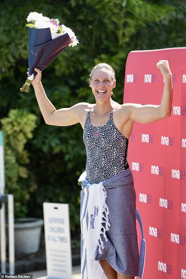 She quickly struck the 'champion' pose as she proudly held up her booty