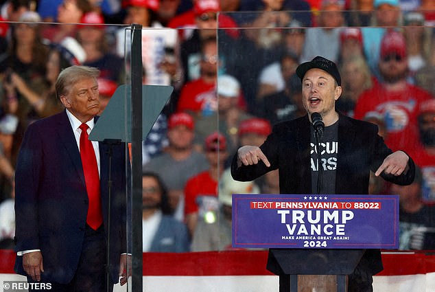 Elon Musk and Donald Trump pictured together at a rally in Butler, Pennsylvania, on October 5