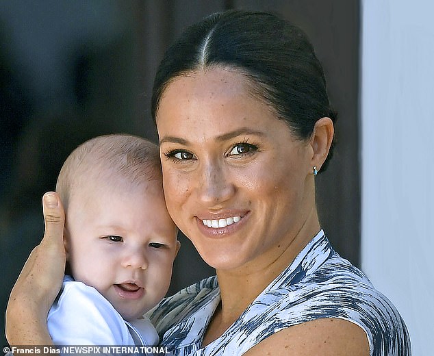 The Duchess of Sussex holds her son Archie, just four months old, in Cape Town in September 2019