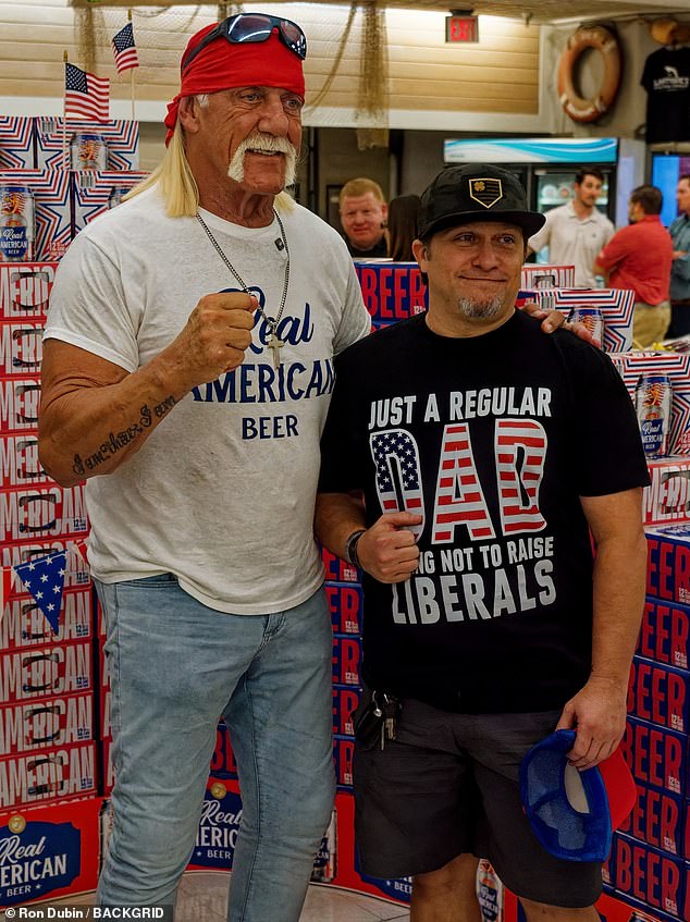 Hogan, whose real name is Terry Gene Bollea, also wore his cross necklace, a statement watch and his wedding ring as he greeted and posed for his excited fans inside the store.