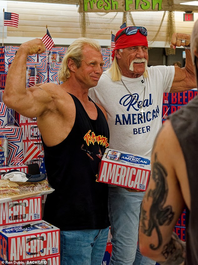 In the crowded supermarket, the former wrestler showed off his muscles as he posed next to his fans and his beer brand as he celebrated Trump's election victory