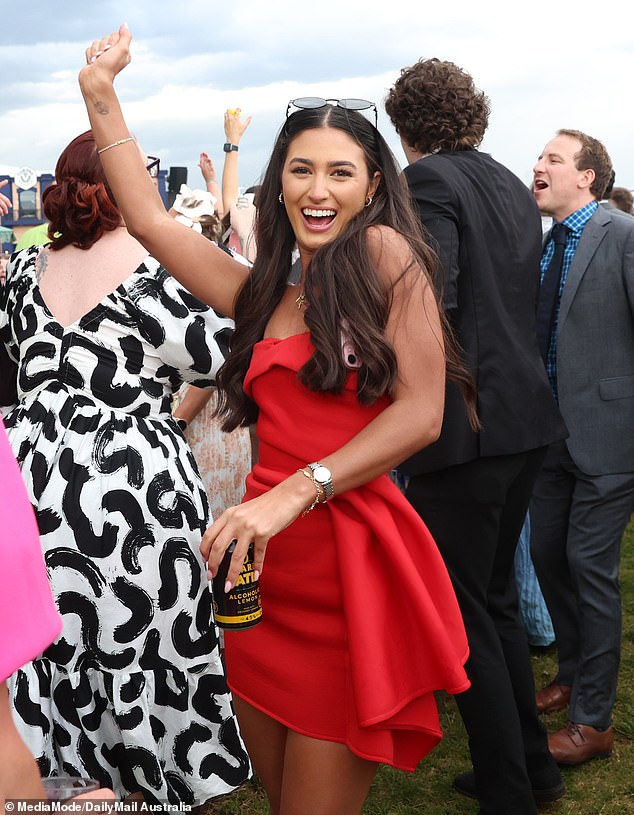 The grassy venue slowly turning to mud didn't stop racegoers from partying hard