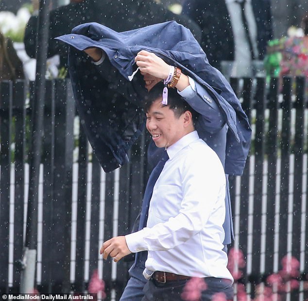 Who needs an umbrella? Several attendees got creative when it started to rain