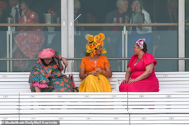 Many partygoers took cover after the rain started, leaving only the most dedicated fans to brave the weather