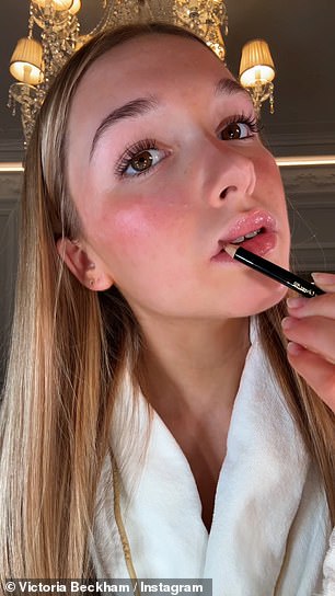 She stared into the camera as she showed off the product before carefully applying it and proudly showing off the results in their lavish hotel room