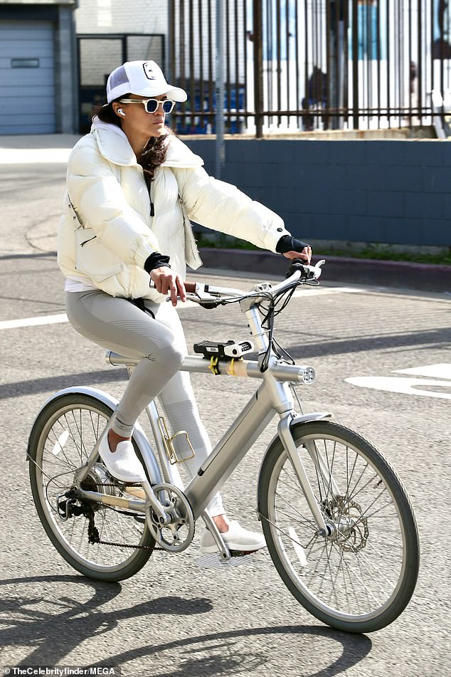 The Fast And The Furious star showed off her athletic physique in a pair of figure-hugging gray leggings while cycling