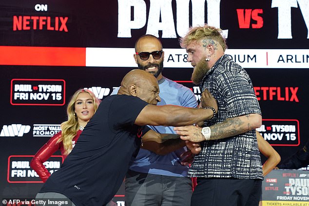 The former world heavyweight champion, who will face Paul Arlington at AT&T Stadium on November 15, was once considered 'the worst man in the world' (pictured in August with Paul during their press conference)