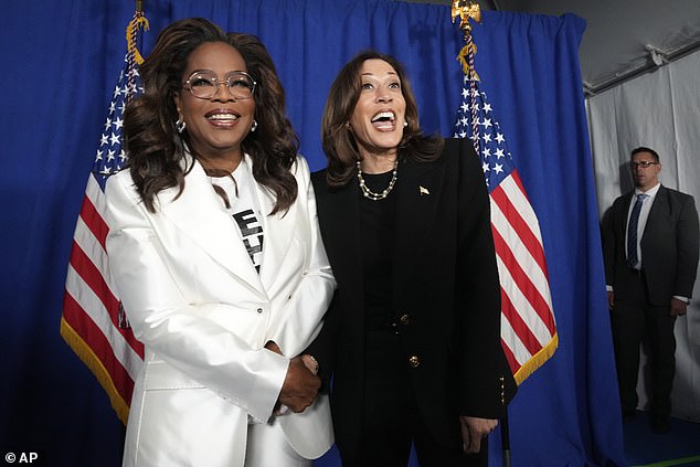 Vice President Kamala Harris, right, poses with Oprah Winfrey in Philadelphia on Monday