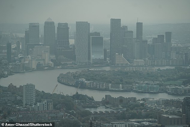 Gloomy weather in London last Friday, as seen in the Canaray Wharf skyline