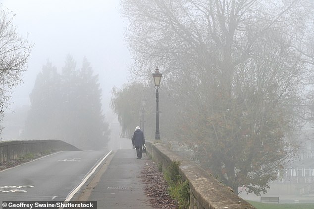 A pedestrian walks through foggy weather in Wallingford, Oxfordshire, last Thursday