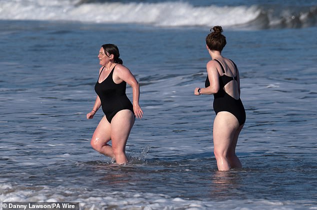 The last day of widespread sunshine in Britain was October 27, when these women were pictured in the water at Cayton Bay in Scarborough, North Yorkshire.