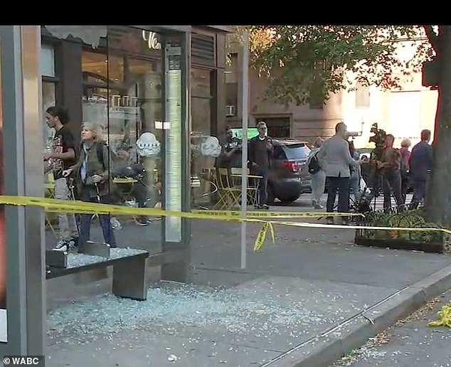 Footage from the scene shows shards of broken glass on the street near a bus stop