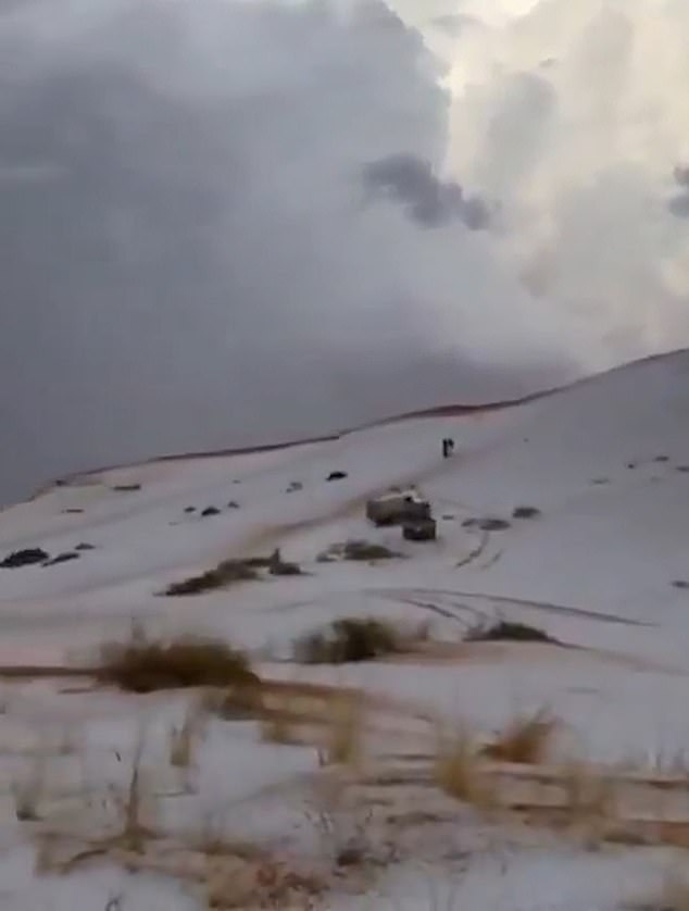 Images and videos show ice droplets – which almost look like snow – covering large areas of the sandy desert