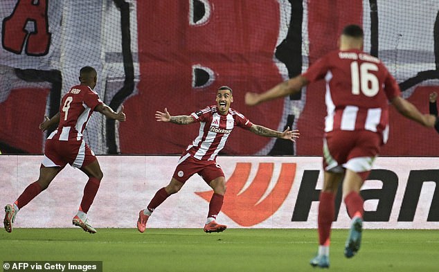 El Kaabi runs off to celebrate after scoring the opener for the Greek team