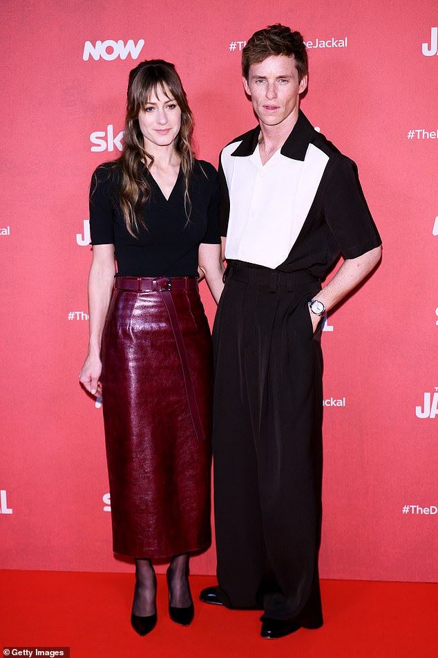 He paired the shirt with black custom wide-leg pants as he posed with his wife of 10 years on the red carpet.