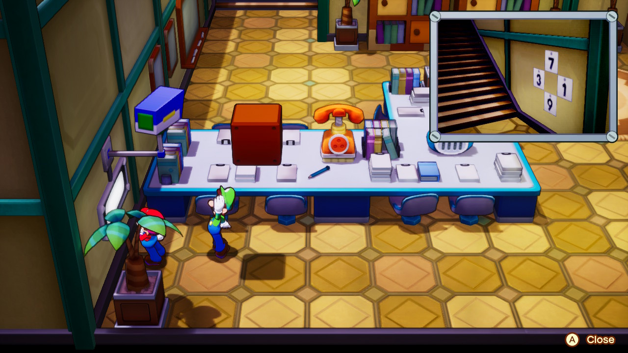 A screenshot from Mario & Luigi: Brothership, in which Mario and Luigi view a security camera in an office building