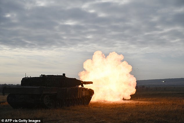 Tankers of the 33rd Separate Mechanized Brigade of the Ukrainian Ground Forces fire with a Leopard 2A4 tank during field training in Ukraine