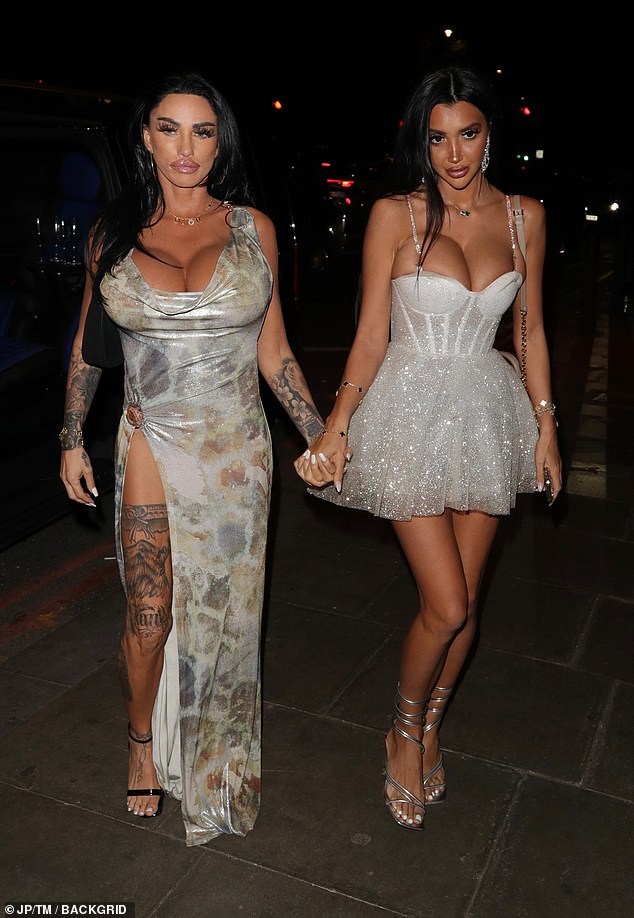 Katie also showed off her tattoos with a thigh-high slit as she walked to the venue in Embankment, London.