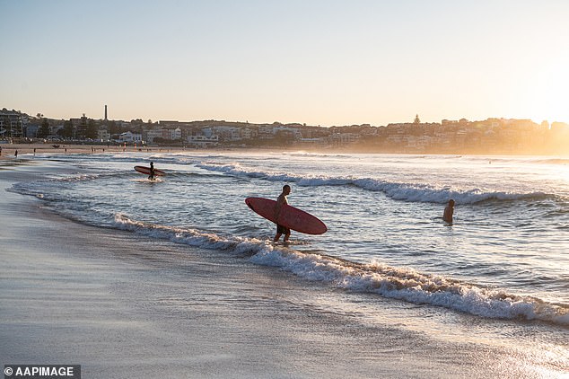 The Harbor City is expected to reach a high of 26 degrees Celsius this weekend amid forecasts of possible showers, while Brisbane could receive up to 5mm of rain on Saturday (pictured, Bondi Beach)