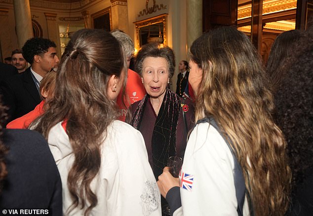 Princess Royal looked stylish in a burgundy coat dress as she stood in for Camilla