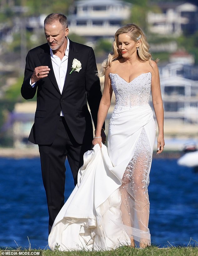 The TV presenter, 51, looked stunning for her big day in a white strapless pearl-encrusted dress by designer Steven Khalil