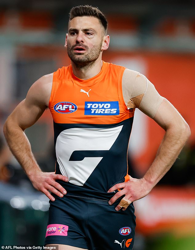 Coniglio is pictured leaving the field after the hit that left him with five facial fractures