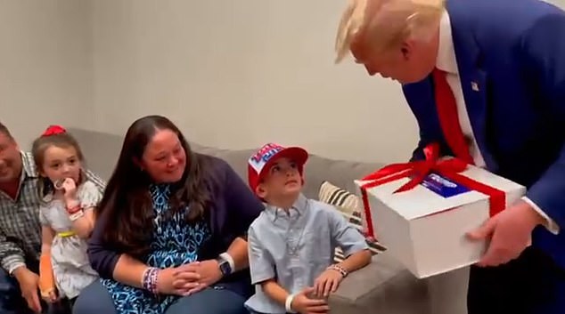 Liam met his hero in person during a meet and greet where Trump brought presents: a box full of MAGA goodies wrapped in a red ribbon